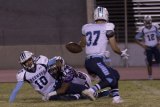 Lemoore's Ray Escandon (No. 32) bore down on Redwood quarterback Hector Gonzalez in Friday's convincing 28-21 win.